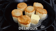 potatoes are being cooked in a skillet with butter and the word delicious written above them .