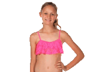 a young girl wearing a bright pink bikini top