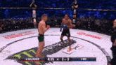 two men are fighting in a boxing ring and the score is 4:35 to 3