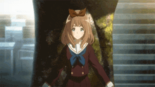 a girl with brown hair and a bow on her head