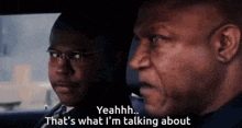 two men are sitting in a car and one of them is saying " yeahh that 's what i 'm talking about "