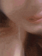 a close up of a woman 's face with ear buds on