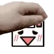 a close up of a person 's hand holding a cartoon face .