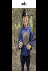 a man wearing a blue shirt that says united states marines