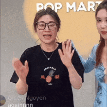 a woman wearing a black shirt that says adorable applauds