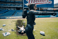 a baseball field with a sign that says ' metropolitan waste '