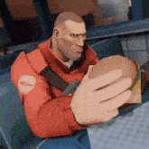 a man in a red jacket is holding a hamburger in his hand