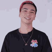 a young man with pink hair is wearing a black shirt that says " golf " on it