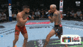 two men fighting in a boxing ring with a can of 2 shots in every can