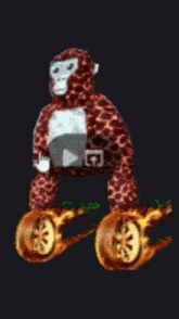 a stuffed animal monkey is sitting on a tree branch with wheels