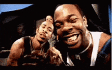 three men are posing for a picture and smiling for the camera