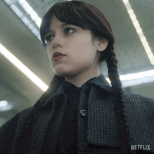 a close up of a woman 's face with the word netflix on the bottom right