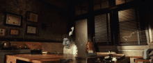 a ghostly face is projected on a wall in a room