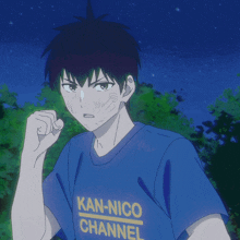 a boy wearing a blue kan-nico channel t-shirt