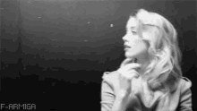 a black and white photo of a woman with the words f-armiga on the bottom left