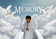 a picture of a man holding a cross with the words in loving memory above him