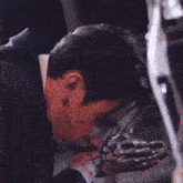 a close up of a person with blood on their face