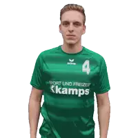 a man wearing a green shirt that says kamps