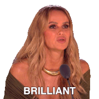a woman is speaking into a microphone and the word brilliant is on the screen