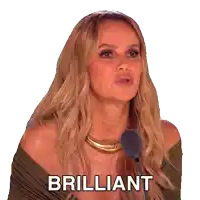 a woman is speaking into a microphone and the word brilliant is on the screen