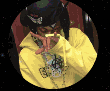 a man wearing a gucci hat and a yellow jacket
