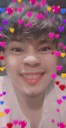 a close up of a person 's face with hearts coming out of his hair