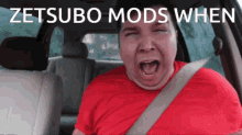 a man in a red shirt is screaming in a car with the words zetsubo mods when written above him