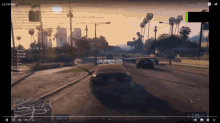 a video of a car driving down a street is being played on a computer