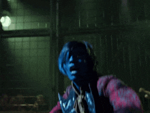 a person with blue paint on their face