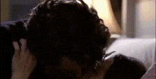 a close up of a person 's head with headphones on .