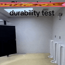 a bathroom with urinals and the words " durability test " above it