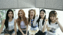 a group of young girls are posing for a picture together
