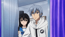 a man and a girl are standing next to each other in a room