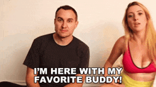 a man and a woman are sitting next to each other and the man is saying i 'm here with my favorite buddy