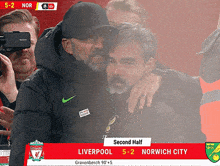 a soccer game between liverpool and norwich city is being played