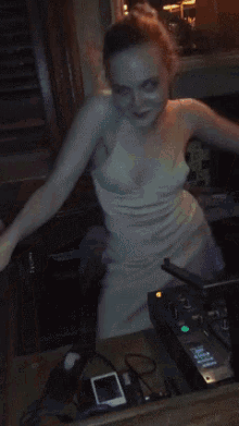 a woman is dancing in front of a mirror
