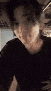 a blurry picture of a person 's face and neck
