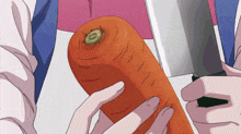 a person is holding a carrot and a knife in their hands