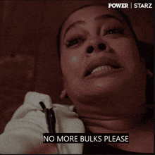 a close up of a woman 's face with the words no more bulks please below it