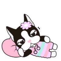 a black and white cat with a pink flower on its head is laying on a pink pillow