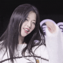 a girl with long black hair is wearing a white sweater with the word endless on it