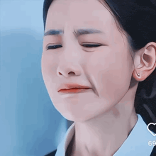 a close up of a woman 's face with chinese writing on it