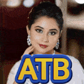 a woman is standing in front of a sign that says atb on it