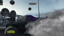 a purple car is drifting in a video game with smoke coming out of the tires .