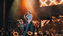 Singing On Stage GIF - Singing On Stage Concert GIFs