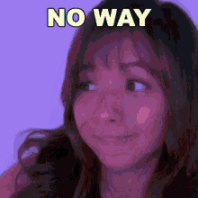 a woman is making a funny face with the words `` no way '' written above her .