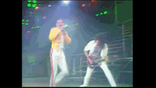 Freddie Mercury Brian May GIF - Freddie Mercury Brian May Roger Taylor GIFs
