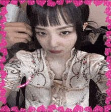 a girl taking a selfie with a pink border around her