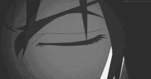 a black and white photo of a person 's eye
