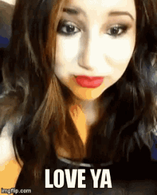 a close up of a woman 's face with the words love ya above her